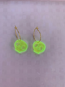 Fluorescent green skull earrings